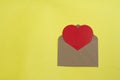 Blank open envelope with heart on yellow background Royalty Free Stock Photo