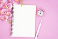 The blank open notebook and clock with pink color orchid for your text or message Royalty Free Stock Photo