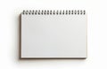 Blank open spiral bound notebook lies on white surface. Simple notepad for writing notes or drawing sketches. Clean pages invite Royalty Free Stock Photo