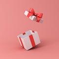 Blank open white gift box or present box with red ribbon bow isolated on light red pink orange pastel color background Royalty Free Stock Photo