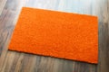 Blank Orange Welcome Mat On Wood Floor Background Ready For Your Text Royalty Free Stock Photo