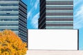 Blank outdoor billboard mockup with modern business buildings Royalty Free Stock Photo