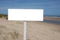 Blank outdoor empty white frame on sand dunes beach in summer day Royalty Free Stock Photo