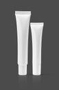 Blank packaging cosmetic tube isolated on gray background Royalty Free Stock Photo