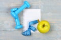 Blank page and gym equipment in cyan blue, top view Royalty Free Stock Photo