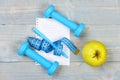 Blank page and gym equipment in cyan blue, top view Royalty Free Stock Photo