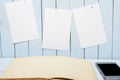 Blank page open book on wooden table. White paper for message on wooden wall