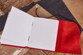 Blank pages of open book with red leather on old wood Royalty Free Stock Photo