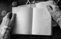 Blank pages opened vintage book on the table