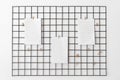 Blank paper attached with pegs on grid as notice, reminder or planing board for succesfully following tasks or goals. Royalty Free Stock Photo