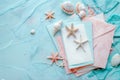 Blank paper on blue pastel background with shells and starfish, empty note for holidays on beach Royalty Free Stock Photo