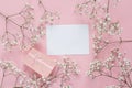 Blank paper card with frame of delicate little white flowers and Royalty Free Stock Photo