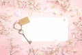 Blank paper card with gypsophila flowers and vintage key on pink background. Space for text. Royalty Free Stock Photo