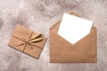 Blank paper card mockup in a craft brown envelope. Vintage letter tied with twine with ears of ripe wheat. Invitation template. Royalty Free Stock Photo