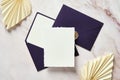 Blank paper card mockup, purple envelopes, dried flowers on stone table. Wedding invitation card template, RSVP mockup