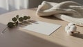 Blank paper card mockup on wooden table with eucalyptus and cotton Royalty Free Stock Photo