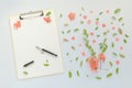 Blank paper on clipboard note pad with floral decoration Royalty Free Stock Photo