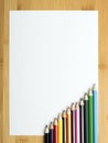 Blank paper and colorful crayons Royalty Free Stock Photo