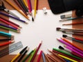 Blank paper and colorful pencils on the wooden table. View from above Royalty Free Stock Photo