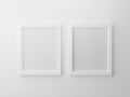 Blank paper frames isolated on white wall at studio. 3d render design concept for product object. Empty clean two picture hanging Royalty Free Stock Photo