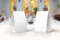 Blank paper menu table tents stands mockup on a marble stage or showroom for designers presentation, promotions etc