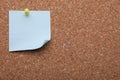 Blank paper note pinned to cork background, closeup. Space for text Royalty Free Stock Photo