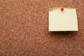 Blank paper note pinned to cork background, closeup. Space for text Royalty Free Stock Photo