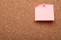 Blank paper note pinned to cork background. Space for text Royalty Free Stock Photo