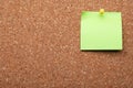 Blank paper note pinned to cork background. Space for text Royalty Free Stock Photo