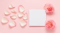 Blank paper note with roses and petals on pink background Royalty Free Stock Photo