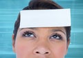 Blank paper note on woman forehead