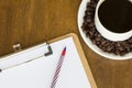 Blank paper with pen and hot coffee cup