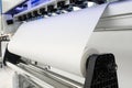 Blank paper roll in large printer format inkjet machine for industrial business Royalty Free Stock Photo