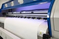 Blank paper roll in large printer format inkjet machine for industrial business Royalty Free Stock Photo