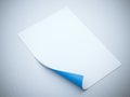 Blank paper sheet with blue curled corner