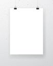 Blank paper sheet hanging on binder clips with textured wall on background. Vertical poster template. Vector mockup Royalty Free Stock Photo