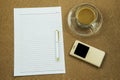 Blank paper with smart phone pen and coffee cup on wooden table, business concept Royalty Free Stock Photo
