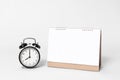 Blank paper spiral calendar for mockup template advertising and branding with clock on gray background Royalty Free Stock Photo