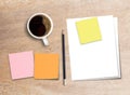 Blank paper,sticky note,coffee on wood table background Royalty Free Stock Photo