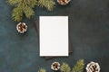 Blank paper surrounded by pine leaves cones. High quality and resolution beautiful photo concept Royalty Free Stock Photo