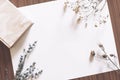 Blank Paper On Table With Book And Dried Flowers Royalty Free Stock Photo