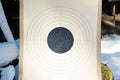 Blank paper target with shooting range numbers. A round, clean target with a marked bull& x27;s-eye for shooting practice on