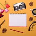 Blank paper with various objcects around it on yellow background - Trendy minimal flat lay concept Royalty Free Stock Photo
