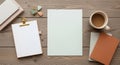 Top View Workspace with Blank Paper Clipboard Coffee and Books on Wooden Desk for Copy Space Royalty Free Stock Photo