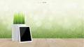 Blank photo frame and flower pot on wooden terrace with light blurred bokeh of green natural area background. Vector Royalty Free Stock Photo