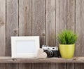 Blank photo frame, heart, camera and plant Royalty Free Stock Photo