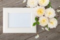 Blank photo frame and white roses Royalty Free Stock Photo