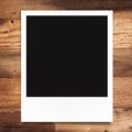 Blank photo frame on wood background Royalty Free Stock Photo