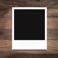 Blank photo frame on wood background Royalty Free Stock Photo