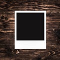 Blank photo frame on wood background Royalty Free Stock Photo